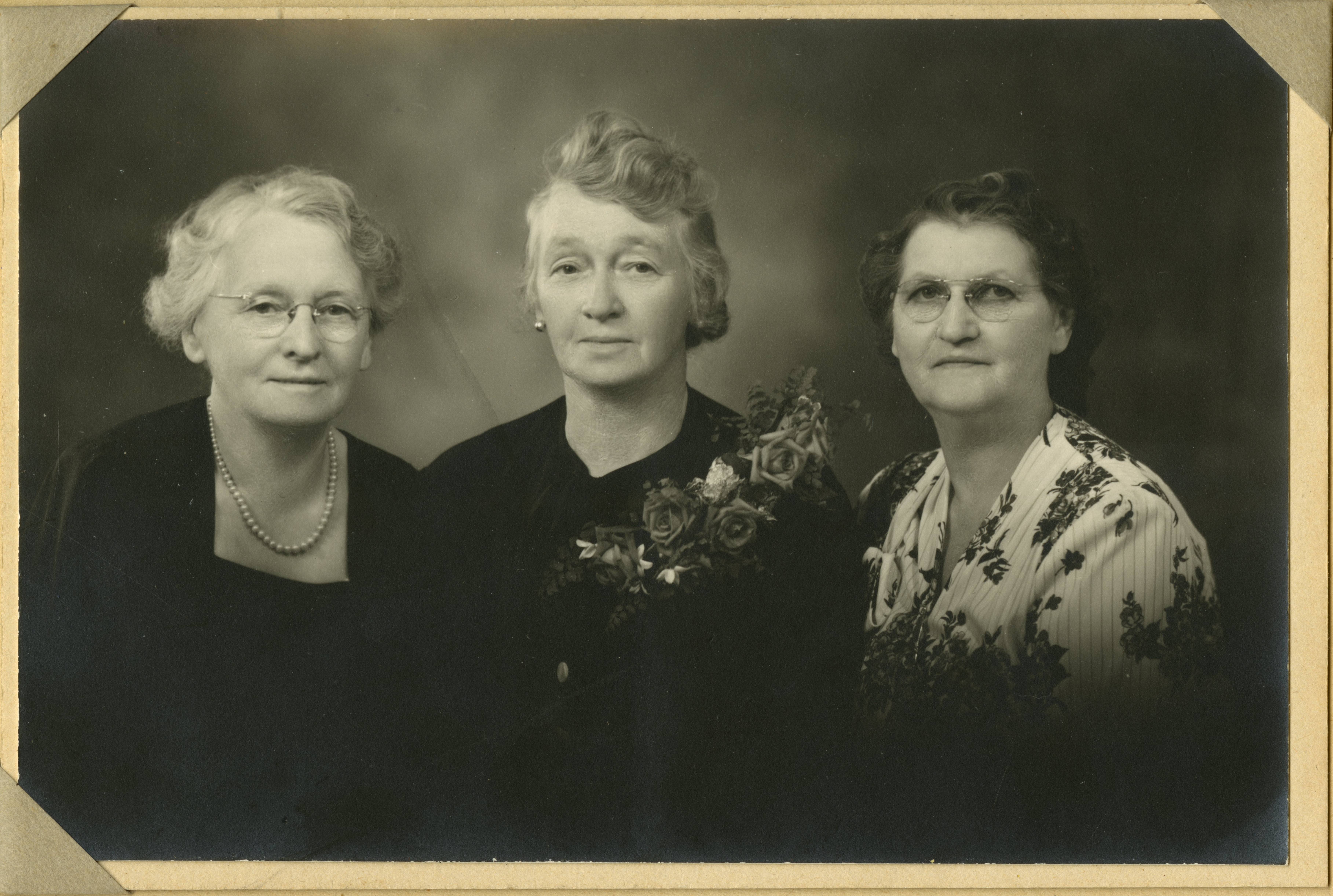 Black and white early 20th century photo with seated women